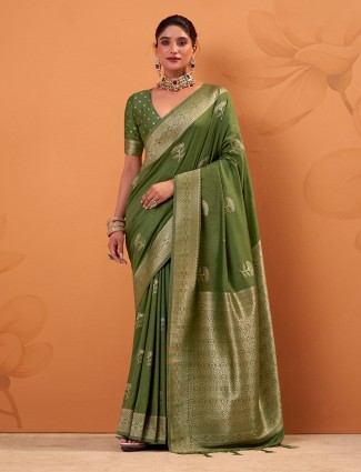 Green tusser silk saree with gleaming zari embellish