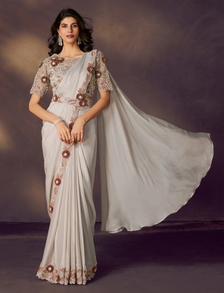 White satin silk saree with cutdana and diamond grace