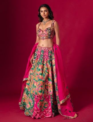 Rani pink raw silk lehenga choli with ornate dupatta