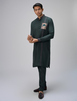 Dark green kurta with pajama attire