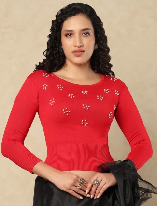 Red woolen blouse with pearl and diamond embellishments