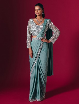Ssage green lycra saree with rich multiwork detailing