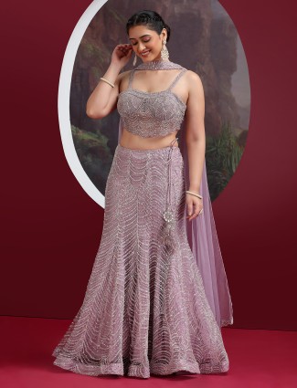 Lavender net designer lehenga with pearl and sequin embellishments