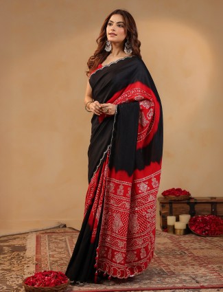 Black silk saree enhanced with subtle aabla touches