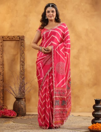 Pink silk saree adorned with graceful aabla detailing