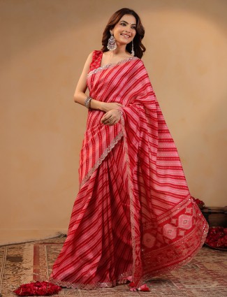 Red silk saree featuring traditional gota work