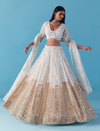 White gold net lehenga with diamond mirror glow