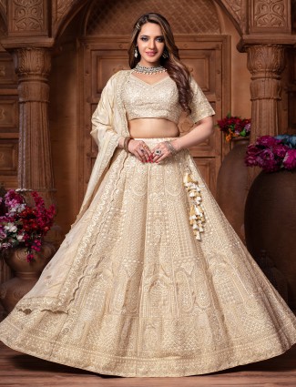 Cream tissue silk lehenga choli with sparkling diamond work