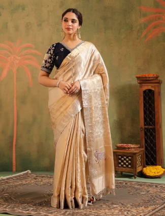Cream silk saree crafted for wedding elegance