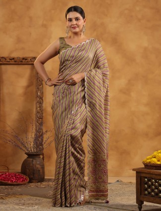 Olive silk saree suited for special festive occasions