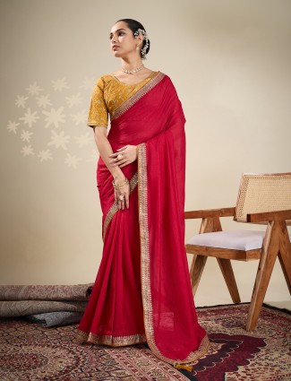 Red plain silk saree with embellished border