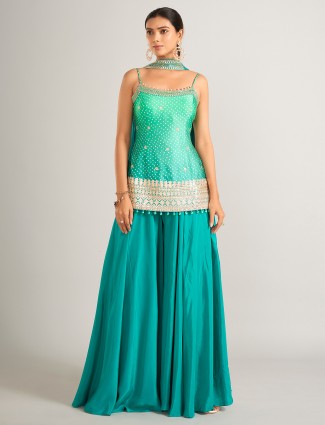 Rama green bandhani silk palazzo suit with intricate embellishments