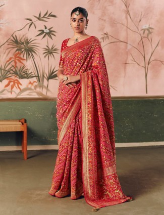 Timeless red bandhej georgette saree with designer tussles
