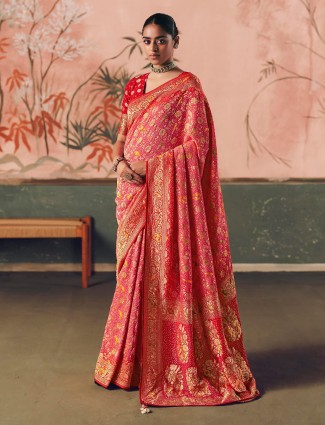 Festive reddish pink bandhej saree with zari embellishment