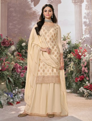 Cream silk pakistani palazzo suit with zari work