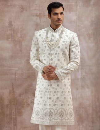 Cream silk sherwani enhanced with thread embroidery