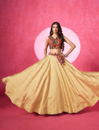 Beige silk lehenga choli with aabla and cowrie shells