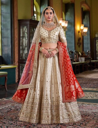 Cream silk bridal lehenga with red dupatta