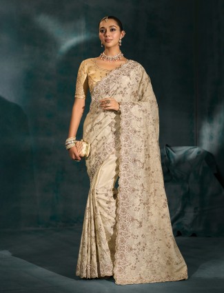 Cream silk saree ideal for wedding celebrations