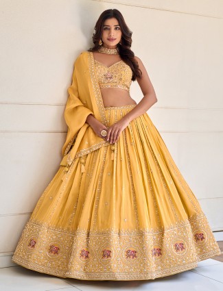 Yellow silk wedding lehenga choli with traditional dupatta